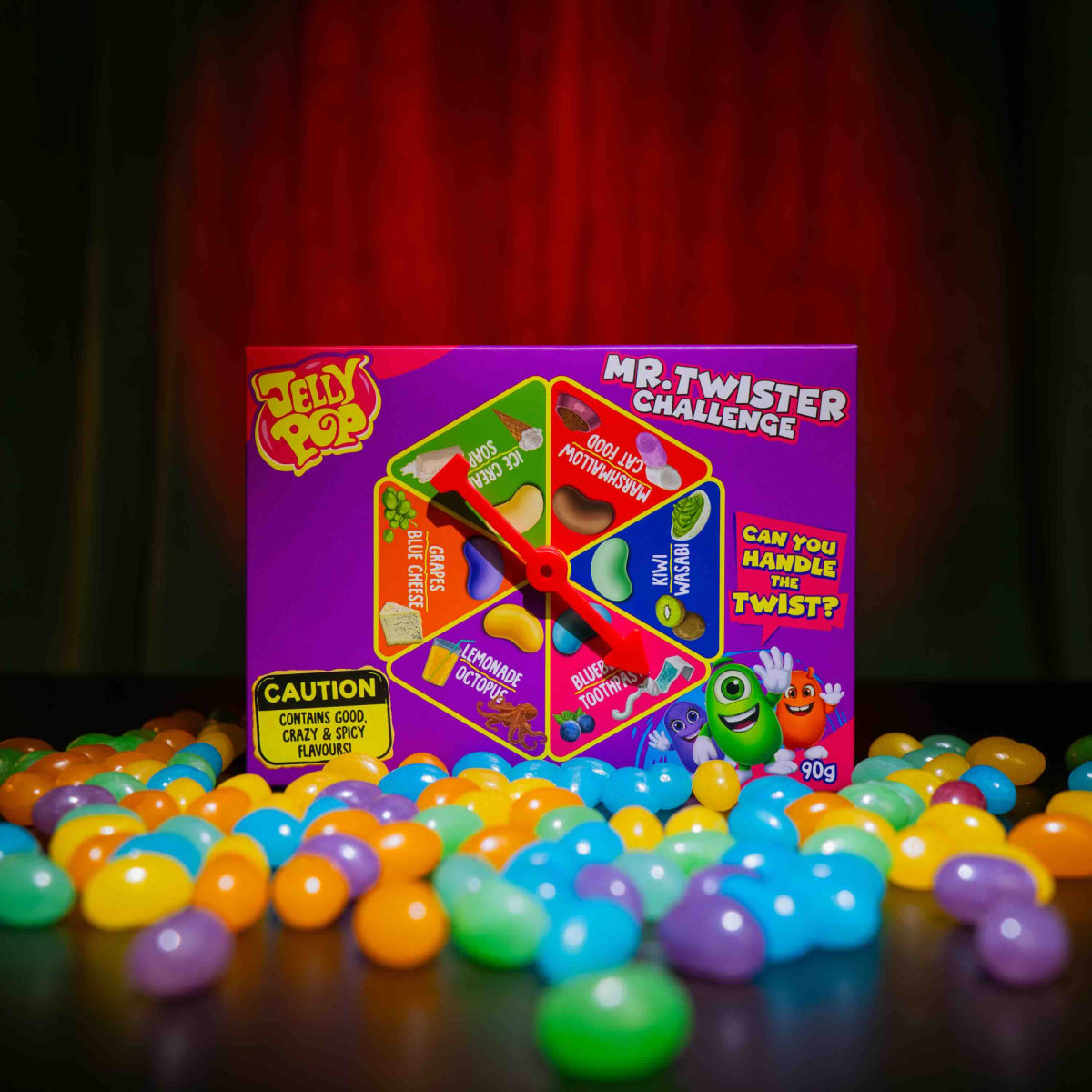 Kutija JellyPop Mr.Twister Challenge bombona, 90 g, okružena šarenim kuglicama